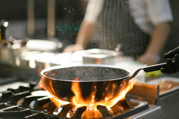 istock Chef performs a fiery show in the hotel kitchen 2171958173