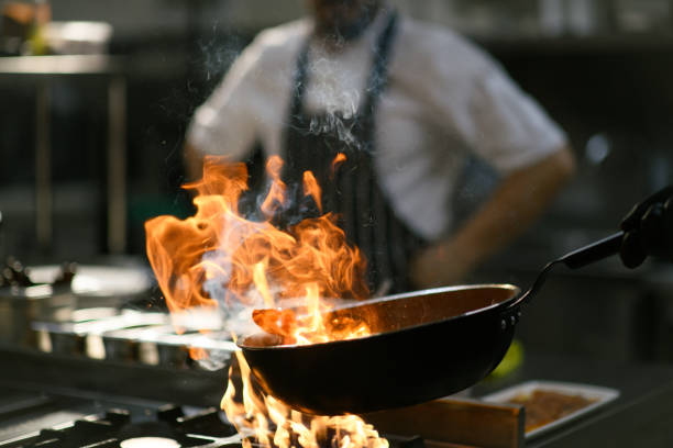 istock Chef performs a fiery show in the hotel kitchen 2171958191