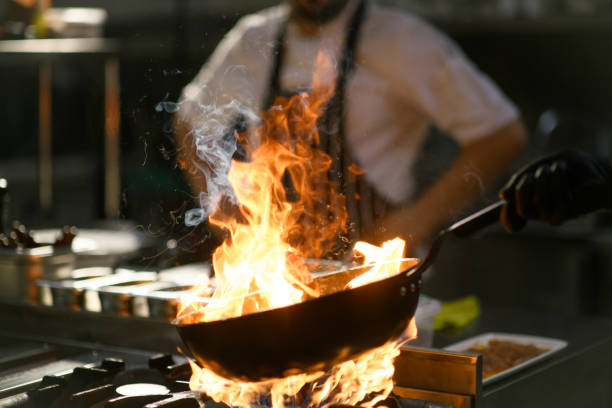 istock Chef performs a fiery show in the hotel kitchen 2171958198