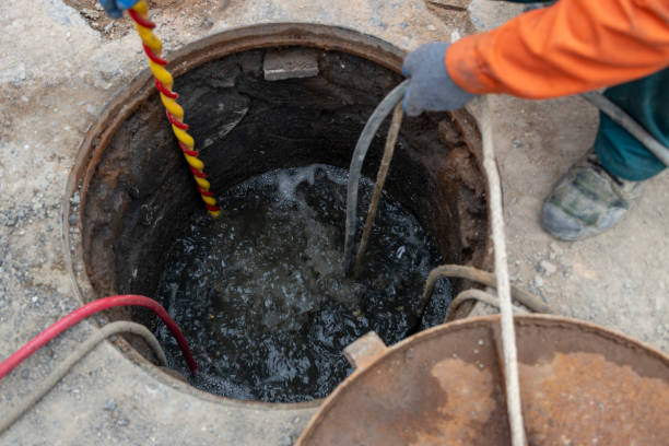 istock City municipal workers are doing urban sewer dredging 2171960848