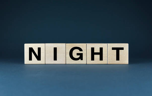 istock A minimalist composition featuring wooden blocks spelling out the word NIGHT 2171964439