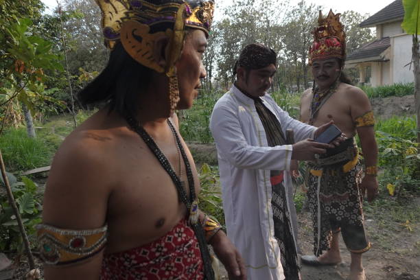 Yogyakarta, Indonesia, Aug 30, 2024. Ketoprak artists wait for their turn to perform backstage, at a traditional arts studio of Tobong Kelana Bhakti Budaya group that continues to survive.