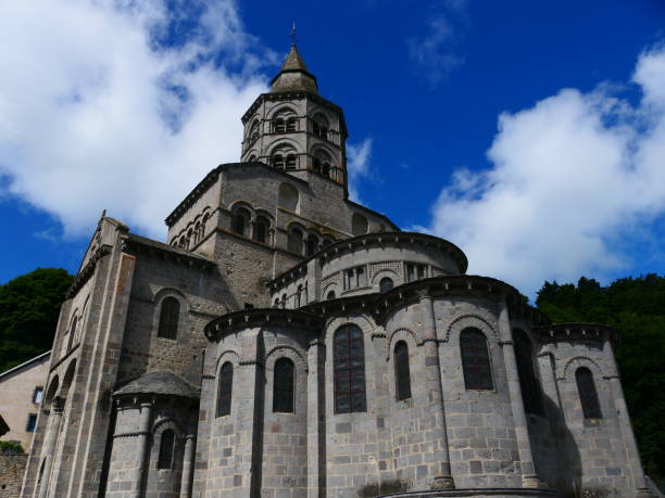 Bell tower of the Notre-Dame d'Orcival basilica, in Auvergne Romanesque style, 12th century, Puy-de-Dôme, Auvergne Basilica of Our Lady of Orcival, in Auvergne Romanesque style, 12th century, Puy-de-Dôme, Auvergne orcival stock pictures, royalty-free photos & images