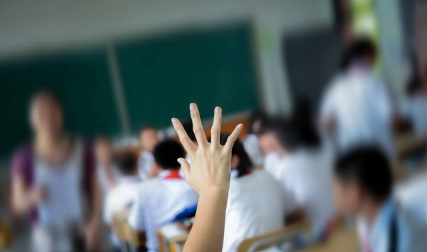 istock Raised hand in class of middle school 2171978530