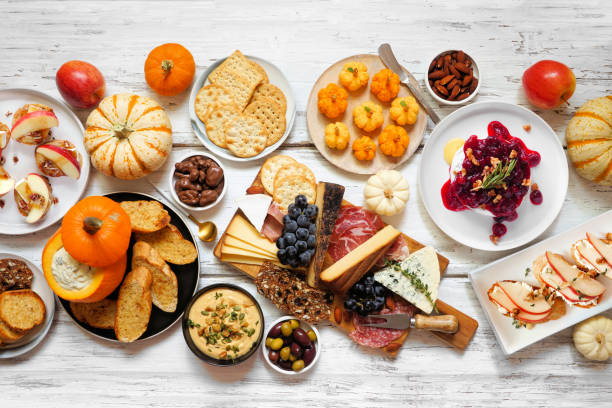 istock Autumn theme appetizer table scene against a white wood background 2171988541