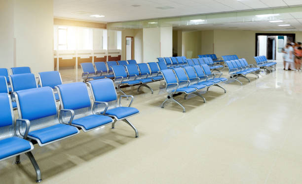 istock Hospital waiting room with row of empty chairs 2171992688