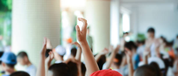 istock Group of happy children with their hands up 2171992770