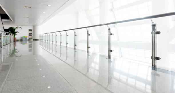 istock Modern corridor with glass handrail in office centre 2171992932