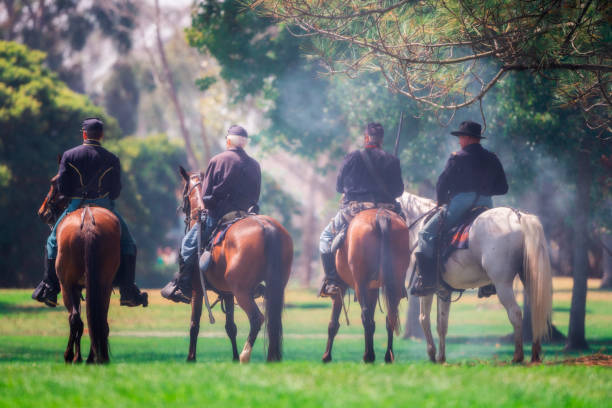 Huntington Beach CA USA - August 31, 2024: Union soldiers on horseback surveying a battle field during a Civil War reenactment,  the Huntington Beach Historical Society hosts, the 31st annual Civil War Days, a reenactment of the Civil War at Huntington Beach Central Park.