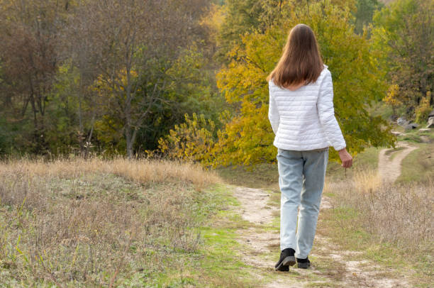 istock Young woman look on autumn landscape. 2171994578