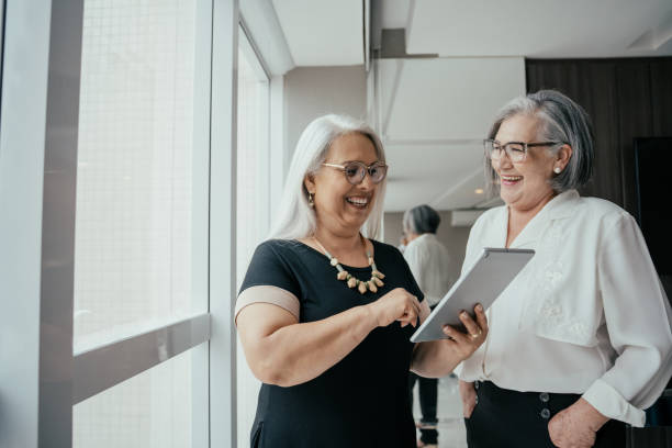 istock Two businesswomen talking about project. 2171995703
