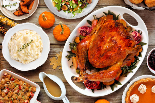 istock Thanksgiving turkey dinner. Overhead view table scene on a rustic wood background. 2171995723