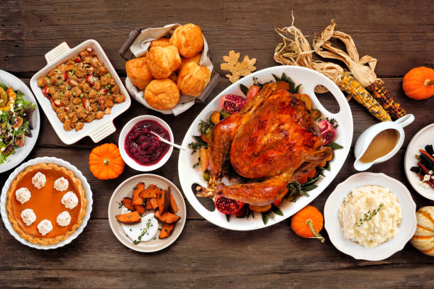 istock Thanksgiving turkey dinner. Top down view table scene on a rustic wood background. 2171995734