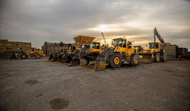 istock yellow wheel loader or bulldozer in formation. Earthmoving and aggregates. Construction work. 2171996899