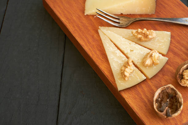 istock A cheese platter with walnuts arranged on a wooden board ready for tasting at a cozy setting 2171998211