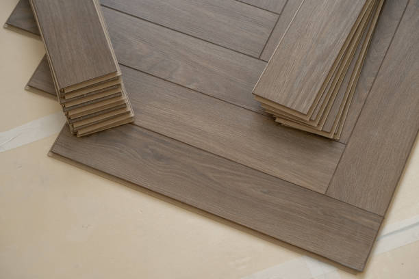 istock Laminate flooring installation in a modern apartment, showing the precise proces 2171998940