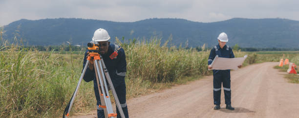 istock Surveyor engineer worker making measuring with theodolite tool equipment at construction site. Surveyors or explorer view construction sites or check security 2172007370