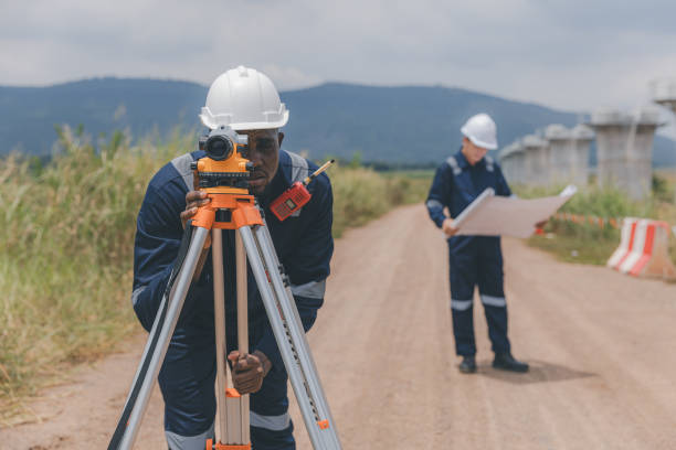 istock Surveyor engineer worker making measuring with theodolite tool equipment at construction site. Surveyors or explorer view construction sites or check security 2172007807