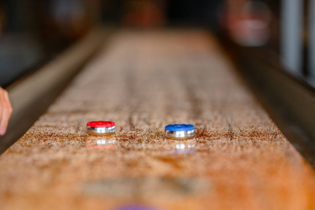 istock Playing a game of shuffleboard.. 2172009264
