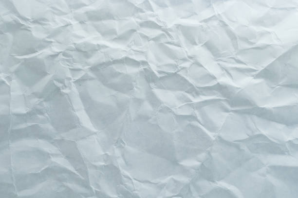 istock Crinkled white paper texture, perfect for backgrounds, art projects, or creative design work. Adds an organic touch to visuals. 2172011290