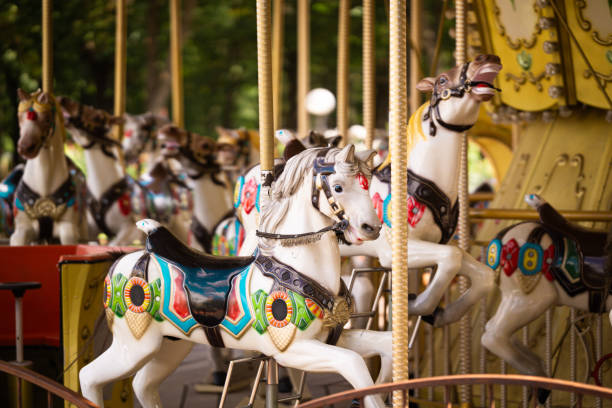 istock A children's attraction in the park, a carousel with horses. 2172019784