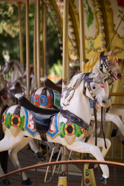 istock A children's attraction in the park, a carousel with horses. 2172019794