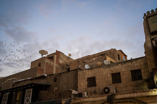 istock Moon at dusk over buildings in Islamic Cairo, Egypt 2172022748