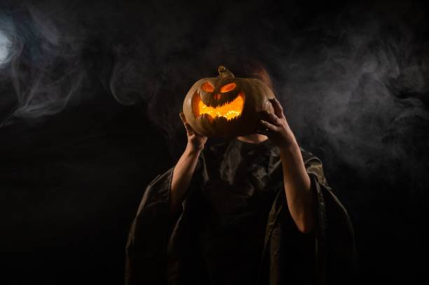 istock Pumpkin jack o lantern instead of a woman's head. Halloween 2172028548