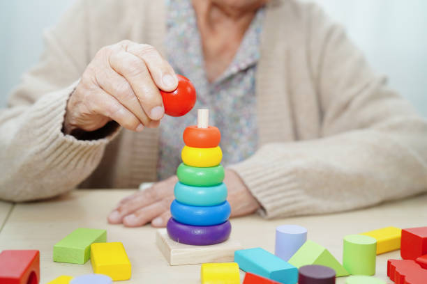 istock Asian elderly woman playing game. 2172030024