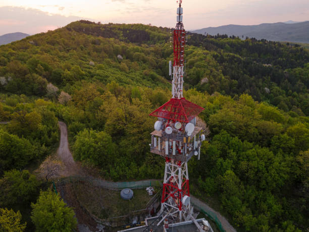 istock Communications Tower at Sunrise in Green Forest in Spring, Aerial View. 2172030954