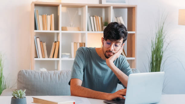 istock Online research distance learning pensive student 2172031385