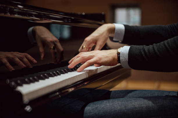 istock Low angle view of hands of a pianist playing pian 2172032591