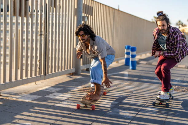 istock Diverse Friends Enjoy Longboarding Outdoors 2172032967