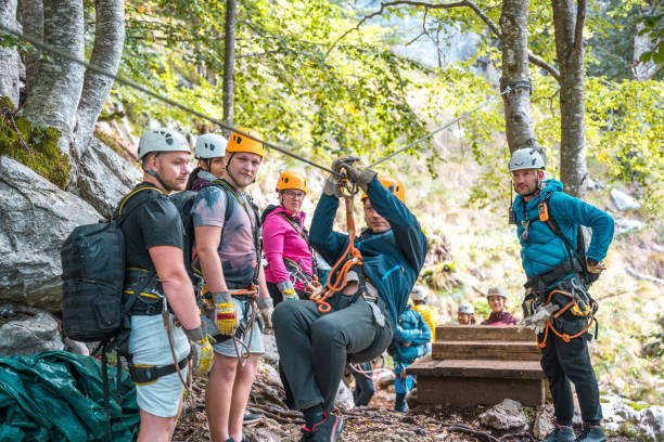 istock Diverse Group Preparing for Zipline Adventure in Forest 2172033339