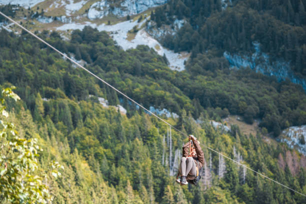 istock Energetic Female on a Mountainous Zip Line Adventure 2172033343