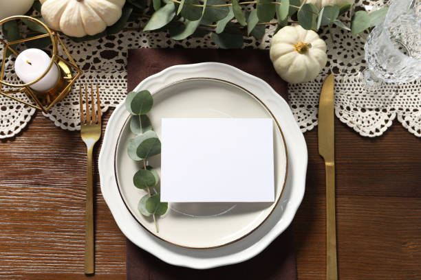 istock Beautiful autumn table setting with blank card and floral decor, flat lay 2172040582