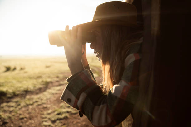 istock Young woman scanning the wilderness 2172042797