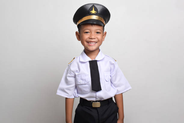 Little Asian boy Airplane pilot isolated on white background. Little boy dreams of becoming an airplane pilot.