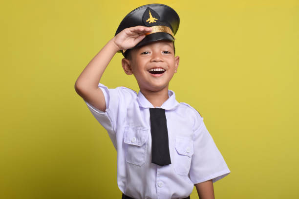 istock Little Asian boy Airplane pilot salute 2172044457