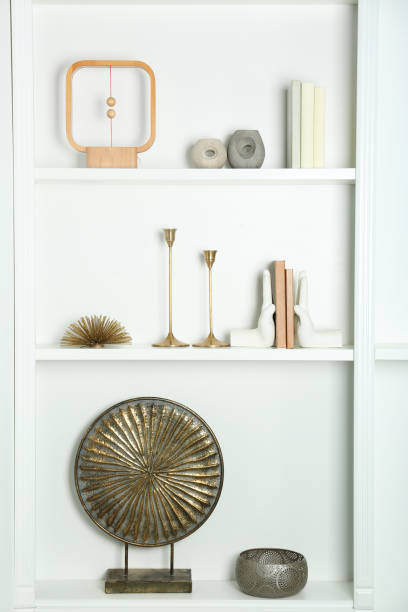 istock White shelves with books and different decor indoors. Interior design 2172047734