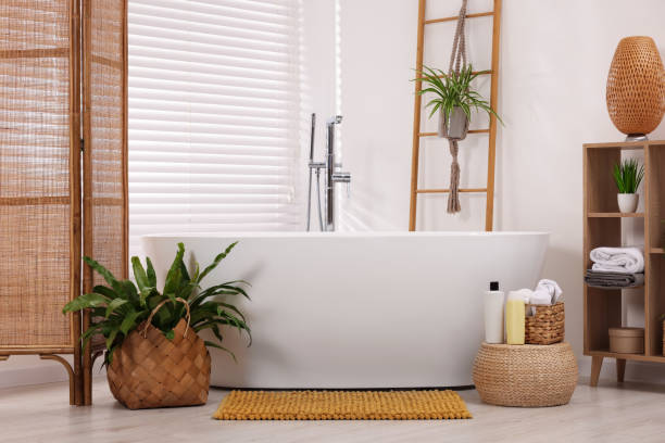 istock Stylish bathroom interior with soft bath mat and tub 2172047756