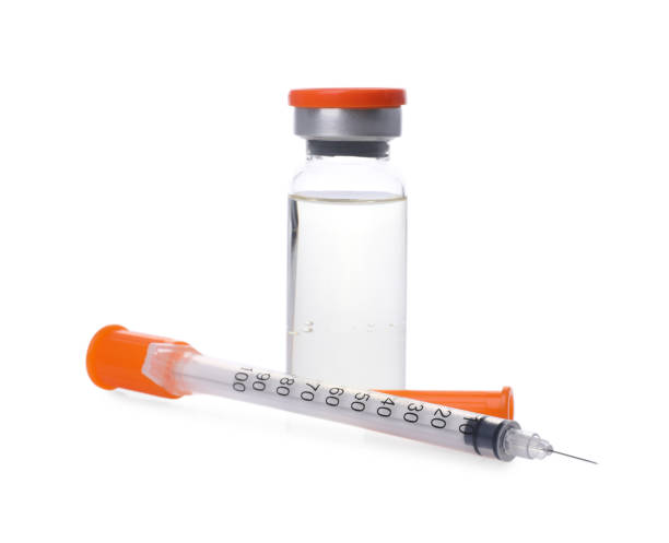 istock Disposable syringe with needle and vial isolated on white 2172048699