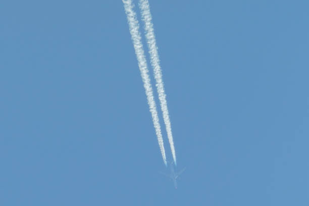 Dispersing vapour trail of a Qatar Airways Airbus A350-1041 plane, registration A7-ANN, flying at 34,000 feet over Sydney Kingsford-Smith Airport as flight QR921 from Auckland to Doha. This image was taken from the 10th floor of a public carpark at the domestic terminal on 14 September 2024.