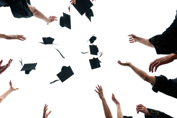 Subject: A group of high school students celebrating their graduation in front of the school.