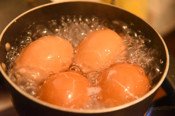 istock Close-up of eggs being cooked in boiling water, precision cooking, kitchen atmosphere, soft-boiled egg preparation 2172051243