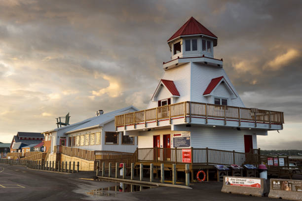 Canada, Shediac - August 22, 2024: Shedia harbor and pier with restaurants and stores at sunrise. Shediac is considered as one of the most important Acadian region and of course, the lobster capital