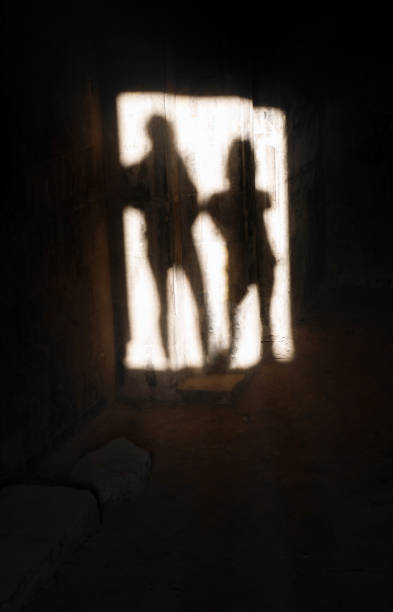 istock Two scary thriller blurry figure shape in silhouette black with backlight in ancient place, shadow haunted on Halloween, concept of UFO or Aliens 2172056899