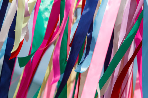 istock Multicolored festival ribbons flutter in the wind. Background 2172060470