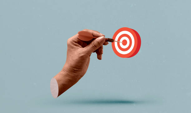 istock Hand holding a dart aiming at the target - business targeting, aiming. Art collage digital pop modern art 2172065749
