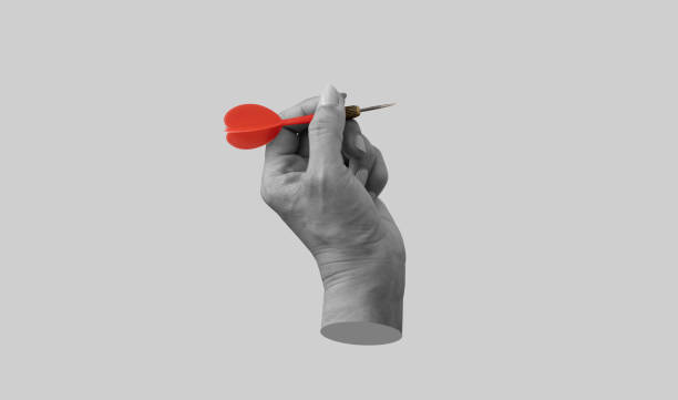 Hand holding a dart aiming at the target. Art collage digital pop modern art